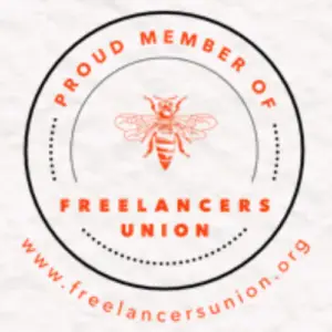 A proud freelancer displaying their membership badge from the Freelancers Union, symbolizing community and support.